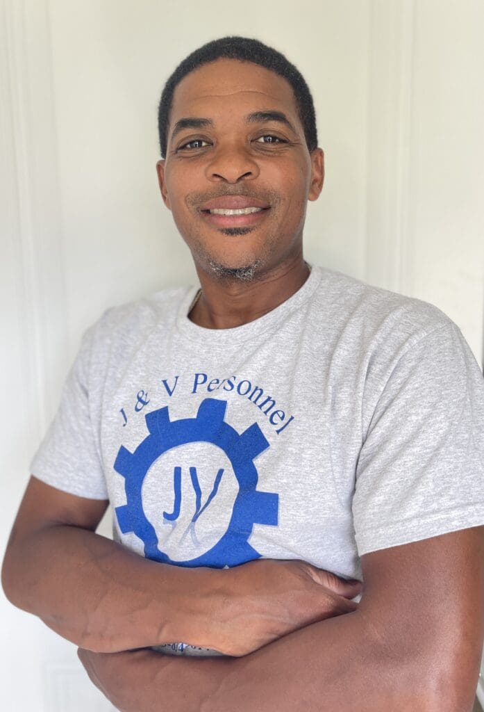 A man in a white shirt and blue gear