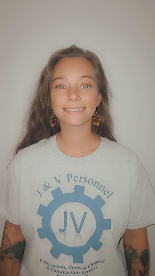 A woman with long hair wearing a t-shirt.